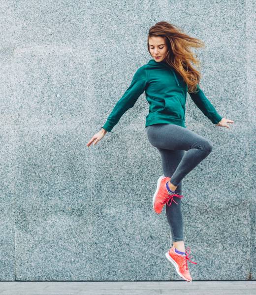 Fitness sport girl in fashion sportswear doing yoga fitness exercise in the street, outdoor sports, urban style
